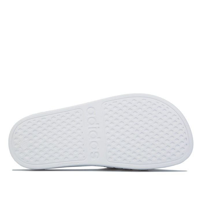 Junior adidas Originals Adilette Slip Sandals in white.<BR><BR>- Synthetic upper.<BR>- Single bandage upper with signature 3-Stripes.<BR>- Slip-on construction.<BR>- Soft Cloudfoam footbed.<BR>- One-piece moulded EVA upper.<BR>- EVA outsole.<BR>- Synthetic upper  Textile and synthetic lining  Synthetic sole.<BR>- Ref.: F35555