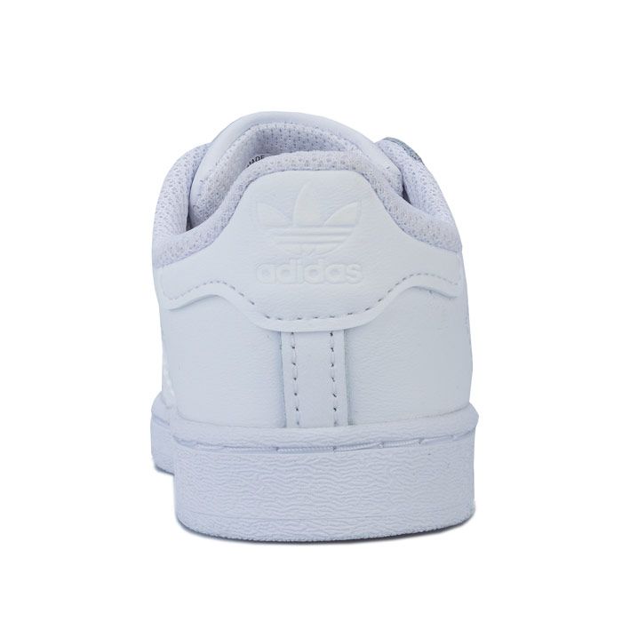 Infant adidas Originals Superstar Trainers in footwear White. – Smooth coated leather upper. – Elasticated lace closure for easy on-off. – Classic rubber shell toe. – Padded collar and tongue. – Tonal 3-Stripes to sides and printed ‘Superstar’ wordmark. – Tonal print Trefoil branding to tongue. – Tonal heel patch with embossed Trefoil logo. – Comfortable textile lining. – Removable Ortholite sockliner for comfort and odour control. – Herringbone-pattern rubber cupsole. – Includes set of regular laces. – Leather and synthetic upper – Textile lining – Synthetic sole. – Ref: EF5397