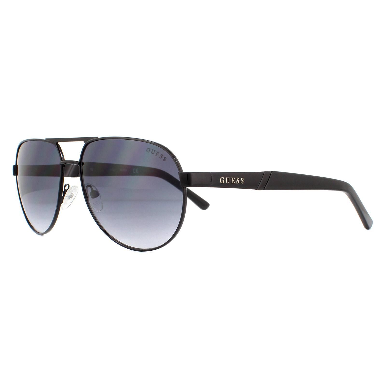 Guess Sunglasses GF5031 01B Black Grey Gradient are a stylish pilot style with a sold metal frame which then merges diagonally, halfway down the arms after the Guess logo, into plastic temple tips.