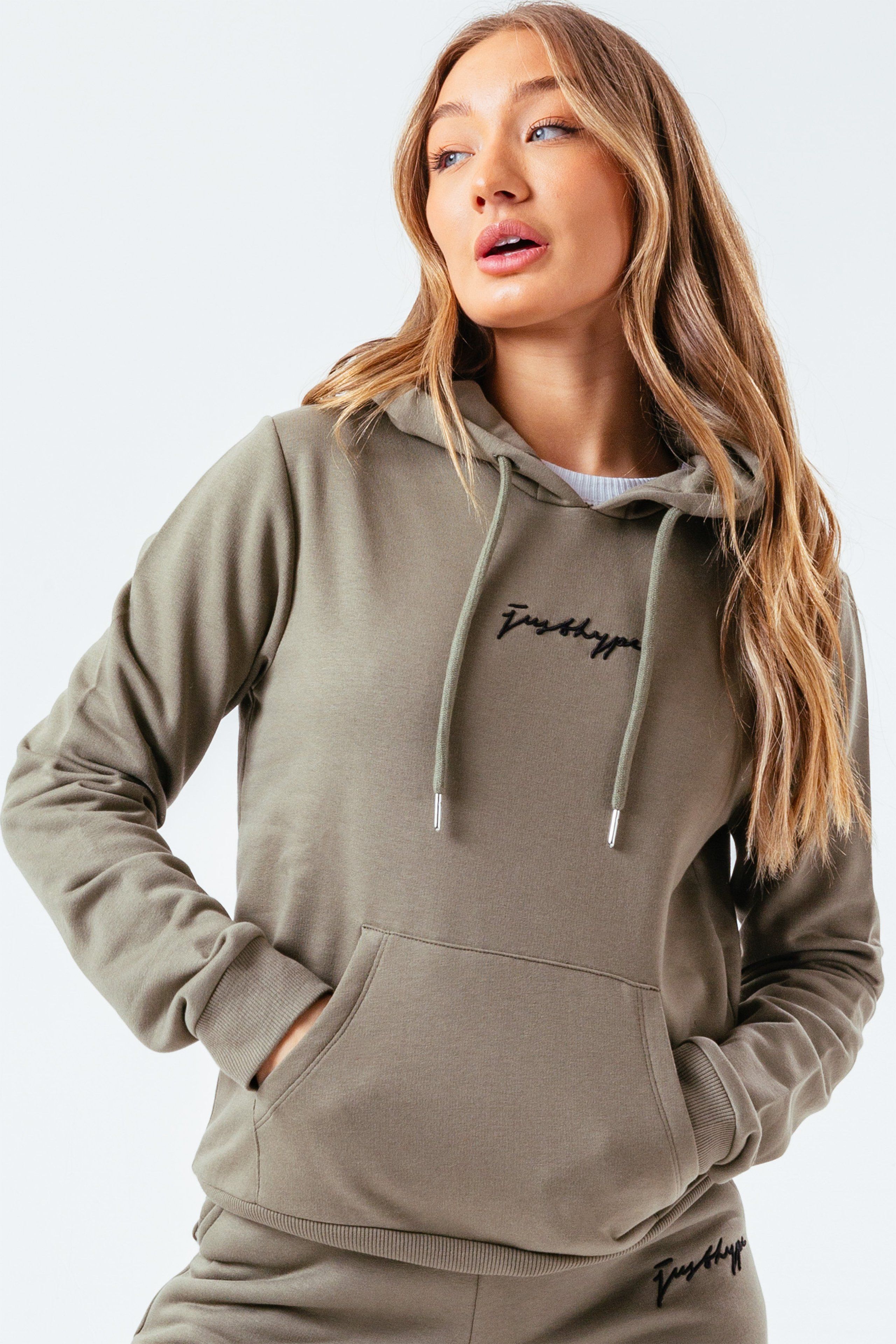 The hoodie staple you need every season. The HYPE. Women's Moss Signature Hoodie. With a fixed hood, fitted cuffs, elasticated waistband and kangaroo pocket. Designed in a moss green 80% cotton and 20% polyester fabric base for the ultimate comfort and breathable space. Wear with the matching joggers to complete your next loungewear look. Machine Washable