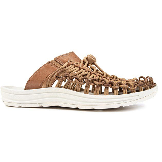 Womens tan Keen uneek slide sandals, manufactured with leather and a rubber sole. Featuring: functional buckled strap, synthetic lining and footbed and premium leather upper.