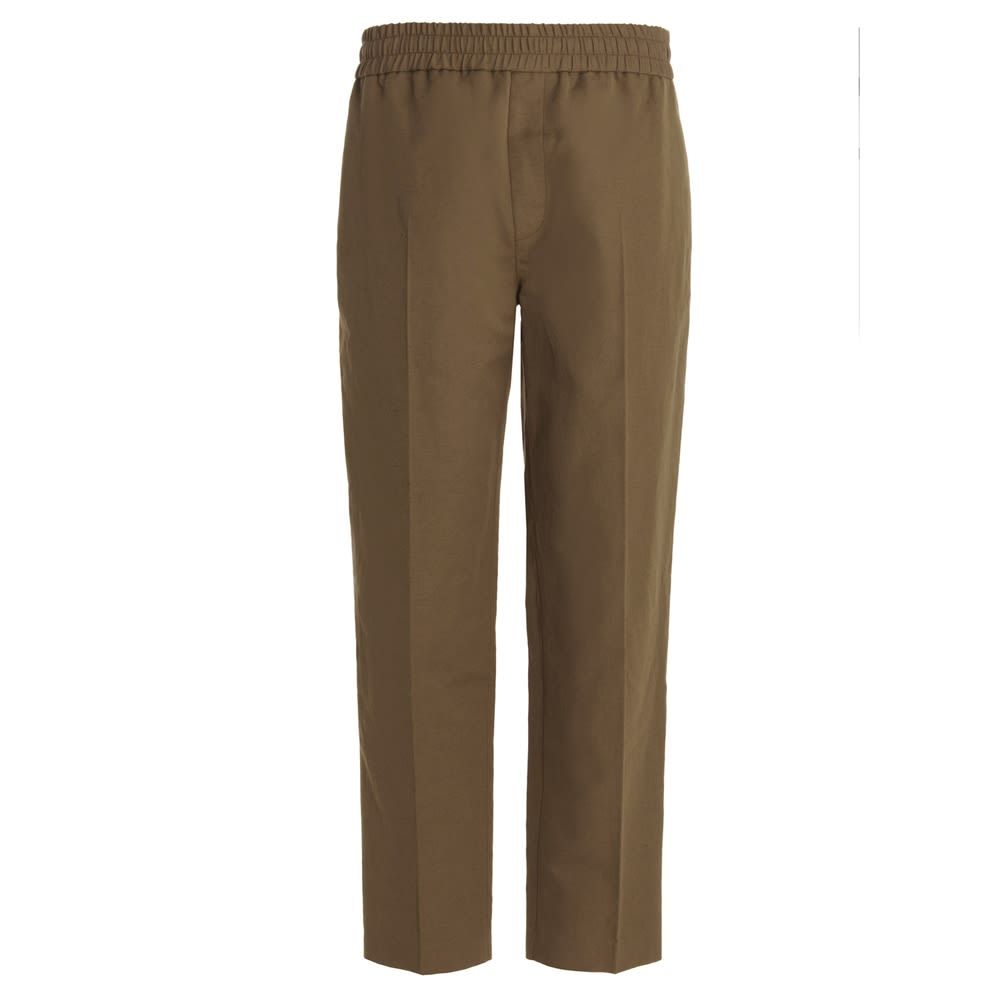 Cotton pants with an elastic waistband and a central crease.