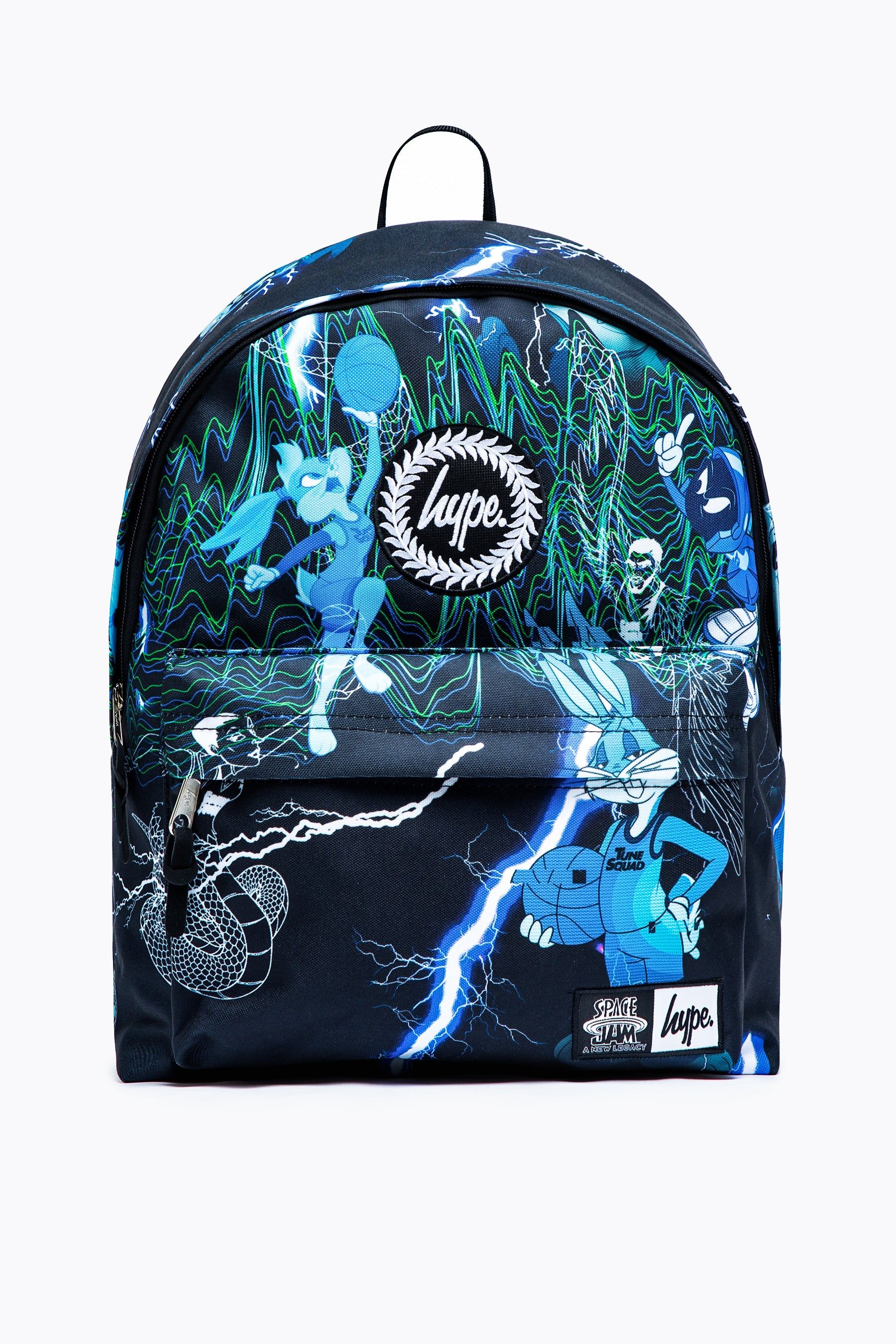 Make a statement in the Space Jam x HYPE. Digital Tune Squad Backpack. Designed in a futuristic inspired all over print in a monochrome, blue and green  colour palette. Featuring your all-time-favourite Looney Tunes characters. Measuring at 42cms x 30cms x 12cms, finished with a front mini pocket, grab handle, embossed zips, branded inside lining and the iconic HYPE. crest badge in monochrome on the front. The straps offer supreme comfort with just the right amount of padding. Wipe clean only.