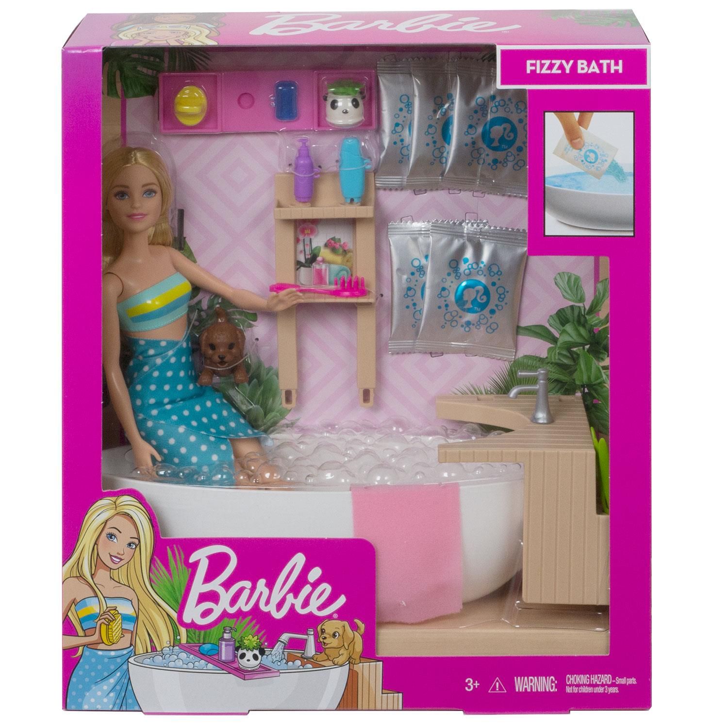 Barbie Fizzy Bath Doll & Playset, Blonde with Tub, Fizzy Powder, Puppy & More

Barbie doll knows the way to be one best is to give yourself the best care This spa-themed playset celebrates one of her favourite ways to recharge: a fizzing bath. It comes with a Barbie doll, a puppy, a spa tub, and accessories to play out a real fizzy bath. Simply fill the tub with water, place the Barbie doll inside and add one of the five included glittery fizz packs to see the water bubble, just like in a real spa Barbie doll can relax with accessories that include a tub tray, bath products, a loofah, a back brush, and a towel. The spa is calming, too, with a wood-inspired frame complete with a panda planter. There's lots of space for puppies to sit, plus spots to store the accessories. Some pieces have a handle the doll can hold to encourage easy role-play fun. The Barbie doll wears a swimsuit with a wrap-around towel and features extra flexibility for realistic posing and active play.

Features:

Kids can practice self-care as they help Barbie doll recharge with this spa-themed playset that lets them play out a classic moment -- a glittery, fizzy bath.
​The set includes a Barbie doll wearing a swimsuit, her puppy, a bathtub, a spa frame, 5 packs of fizzy powder and accessories to help play out a relaxing bath.
​To start the spa-like action, fill the tub with water, place the doll inside and add one of the glittery fizz packs -- the water will change colour, bubble, and foam for a life-like experience.
​Bath accessories expand the storytelling opportunities -- handles on some of the pieces make it easier for kids to role-play; place the products and brushes on the bath tray or store them on the spa frame.
​The wood-inspired frame has a plug-and-play design to hold accessories in place for active play and easy cleanup; plants add realistic calming touches.

Package Includes: Barbie Fizzy Bath Doll & Playset
