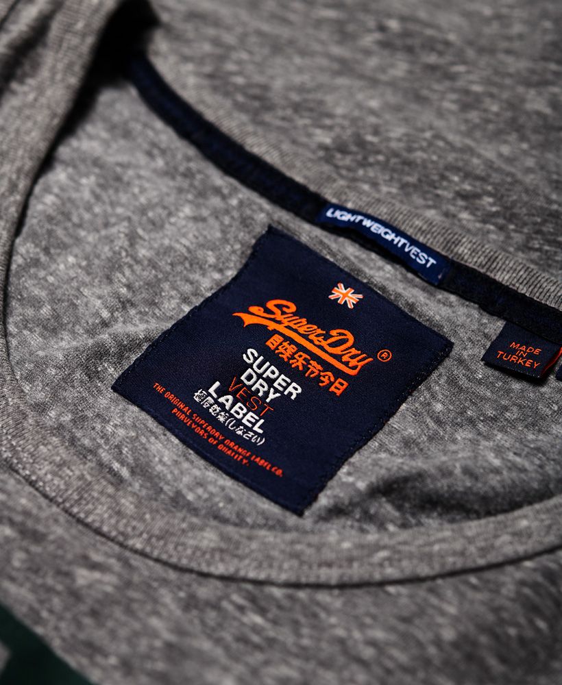 Superdry men's Vintage Logo cali stripe vest top. An essential this season, the Vintage Logo cali stripe vest top features a stripe logo graphic across the chest and has been completed with a small logo tab in the side seam. Pair with shorts and flip flops to complete the look.