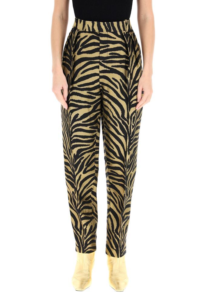 Magdeline viscose trousers by KHAITE with a black and gold jacquard zebra motif. The high-waisted silhouette is completed by front , side and one rear welt pockets and belt loops at the waist. The model is 177 cm tall and wears a size US 2.