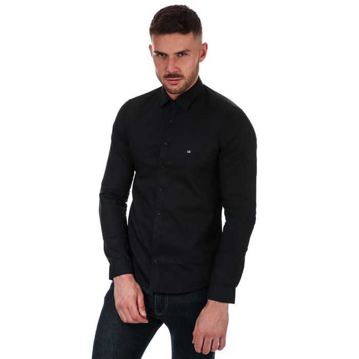Mens Calvin Klein Extra Slim Poplin Stretch Shirt in black.- Classic collar.- Full button placket.- Long sleeves with triple button cuffs.- Rounded hem.- Embroidered Calvin Klein monogram logo at left chest.- Extra slim fit.- Soft stretch cotton poplin construction.- 98% Cotton  2% Elastane. Machine washable.- Ref: K10K1057640GN