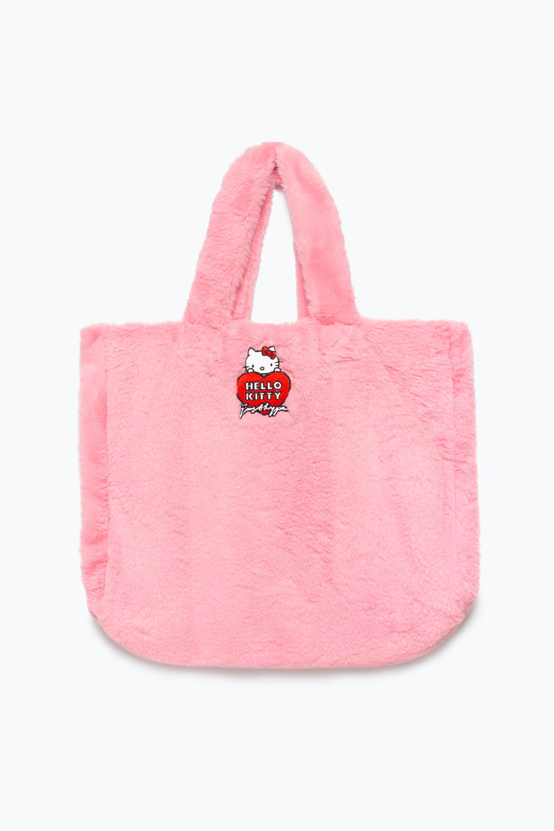 You can never have too many totes! Meet the HYPE. X Hello Kitty Pink Fur Tote Bag, part of our brand new collaboration collection and your new go-to accessory. Designed in a standard tote bag shape, boasting an all-over fur fabric and an embroidered Hello Kitty badge finish. Perfect for carrying all your everyday essentials without sacrificing your style.