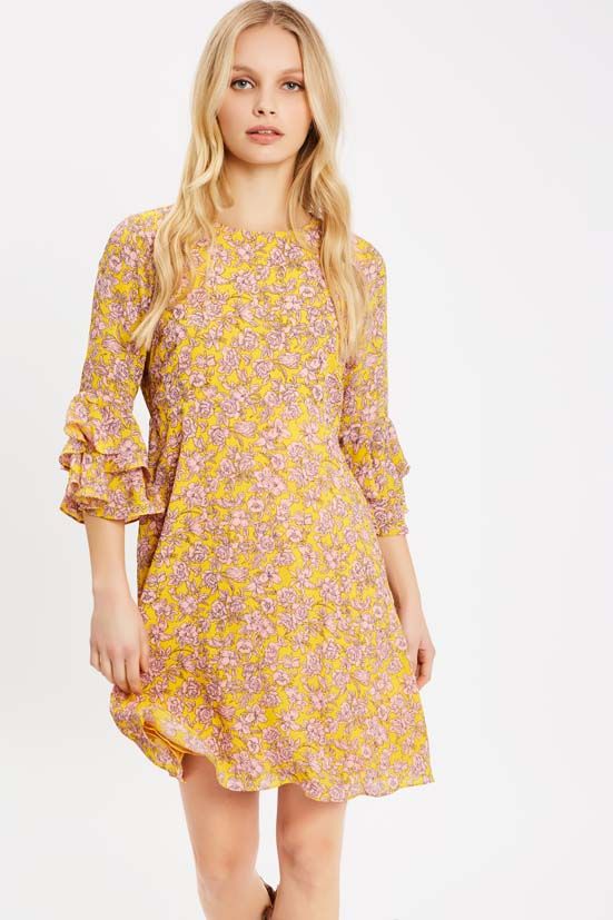 Imbued with a ditzy floral finish, the fun Fools Floral Mini dress is a style that  makes you want to wander. Fun ruffle sleeves in a delightful floral print lend this beautiful bias-cut design a feminine finish, offset by a flattering crew neck and back zip fastening