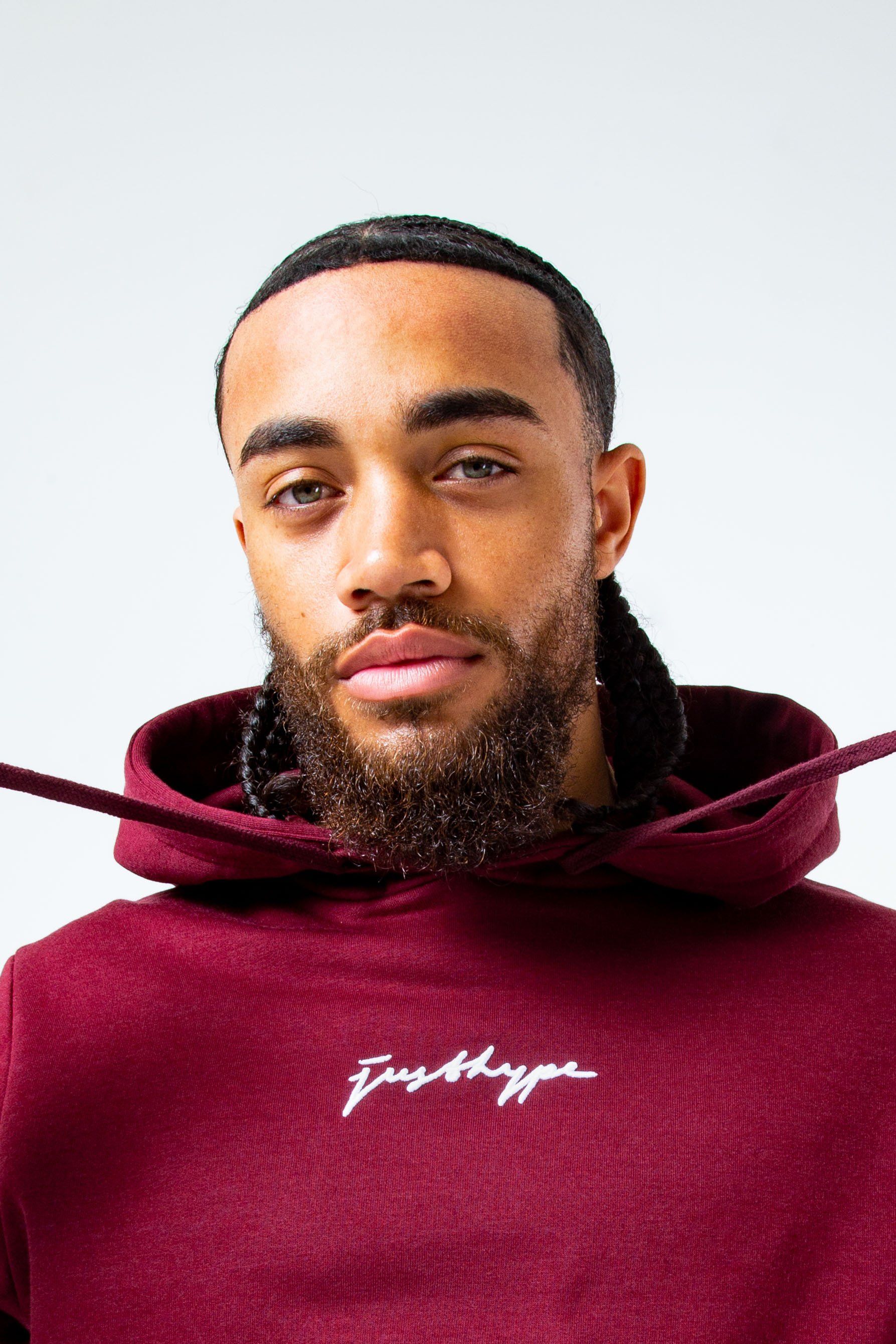 The hoodie staple you need every season. The HYPE. Burgundy Men's Pullover Hoodie is available in a sizes XXS to XXXL. Boasting a fabric base of 80% cotton and 20% polyester, creating the supreme amount of comfort you need. For a relaxed casual vibe, wear with the matching joggers to complete the look. Designed in a burgundy base with a contrasting black embroidered new! justhype signature logo. Finished with a fixed hood, kangaroo pocket and fitted hem and cuffs. Machine washable.
