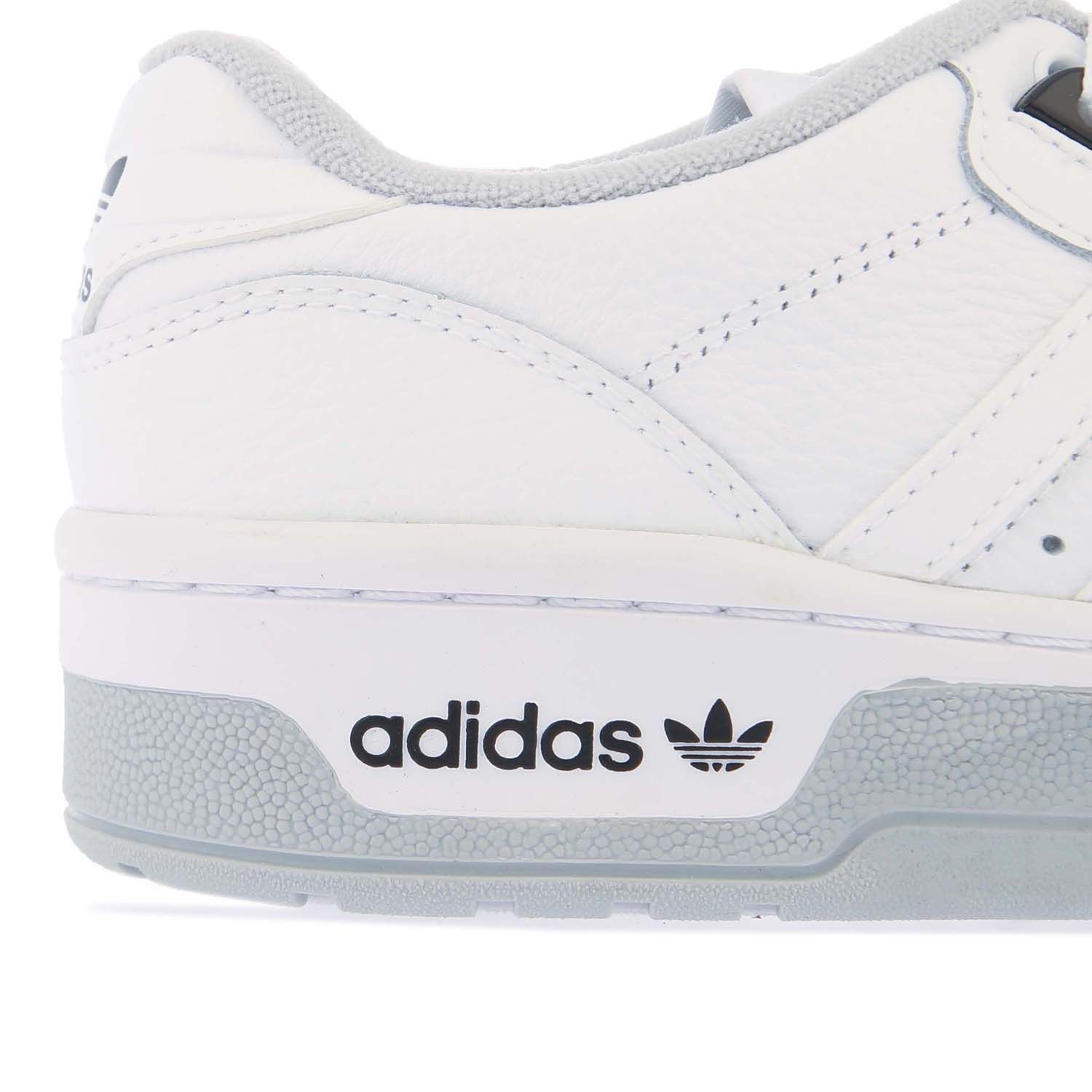 Womens adidas Rivalry Low Premium Trainers in white grey.- Leather upper. - Lace fastening.- Exposed foam tongue.- Terry towel lining.- Rubber outsole.- Leather upper  Textile lining.- Ref.: H04398