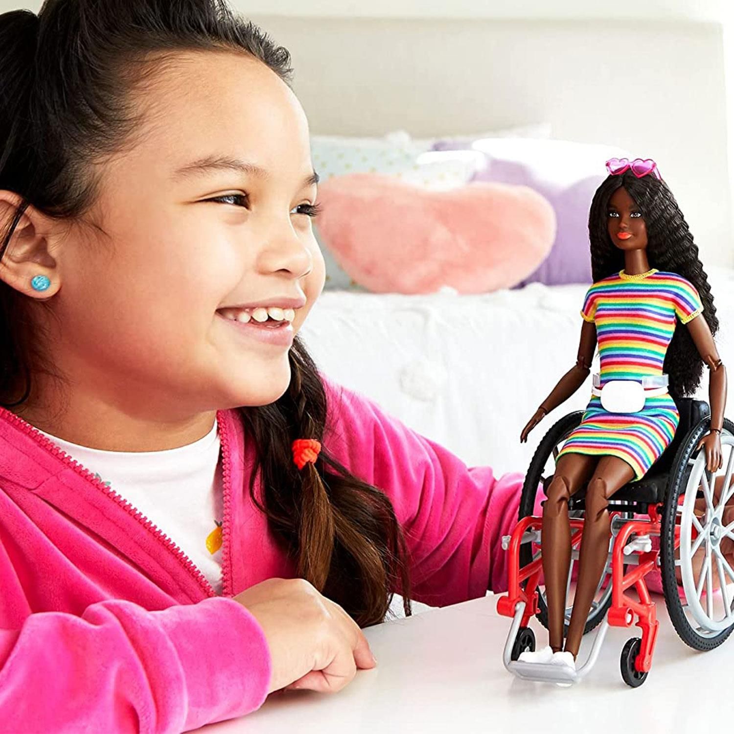 Barbie Fashionistas Doll with Wheelchair and Ramp, Great Toy For Children

Barbie and Ken Fashionistas celebrate diversity with fashion dolls that encourage real-world storytelling and open-ended dreams! With a wide variety of skin tones, eye colours, hair colours and textures, body types and fashions, the dolls are designed to reflect the world kids see today. Barbie doll inspires new play possibilities with a manual wheelchair and ramp so she can easily get in and out of the Barbie Dreamhouse (sold separately, subject to availability). Kids can collect them for infinite ways to play out stories, express their own style and discover that fashion is fun for everyone! Includes doll-wearing fashions and accessories. Each is sold separately, subject to availability. Barbie dolls cannot stand alone. Flat shoes fit dolls with articulated ankles or flat feet. Colours and decorations may vary.

Features:

​The latest line of BarbieFashionistas dolls includes different body types and a mix of skin tones, eye colours, hair colours, hairstyles and so many fashions inspired by the latest trends!
​Barbiedoll comes with a wheelchair that has rolling wheels and a working brake, plus a ramp that works with the BarbieDreamhouse (sold separately).
​The doll also features 22 