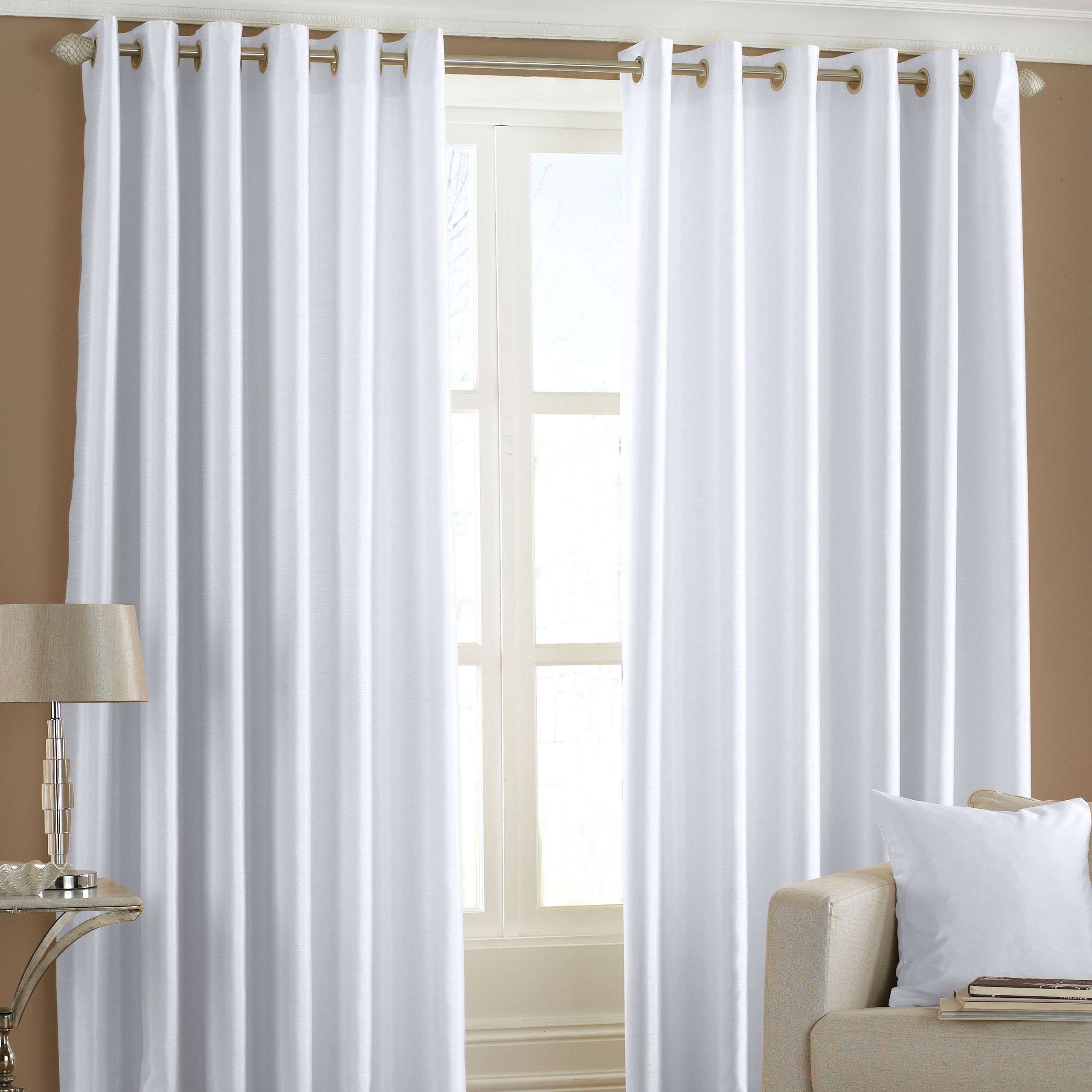 The Fiji curtains embody all the bright colours you’d find on a tropical island – from the vibrant pinks of the flowers to the deep blues of the sea. The luxurious faux silk fabric reflect light at all angles while being soft to the touch. These iridescent eyelet curtains are easy to hang with no need for hooks or rings and are made of semi-sheer material to allow just the right amount of light through. Made of 100% polyester these lustrous curtains are made of hard-wearing polyester and are fully machine washable.