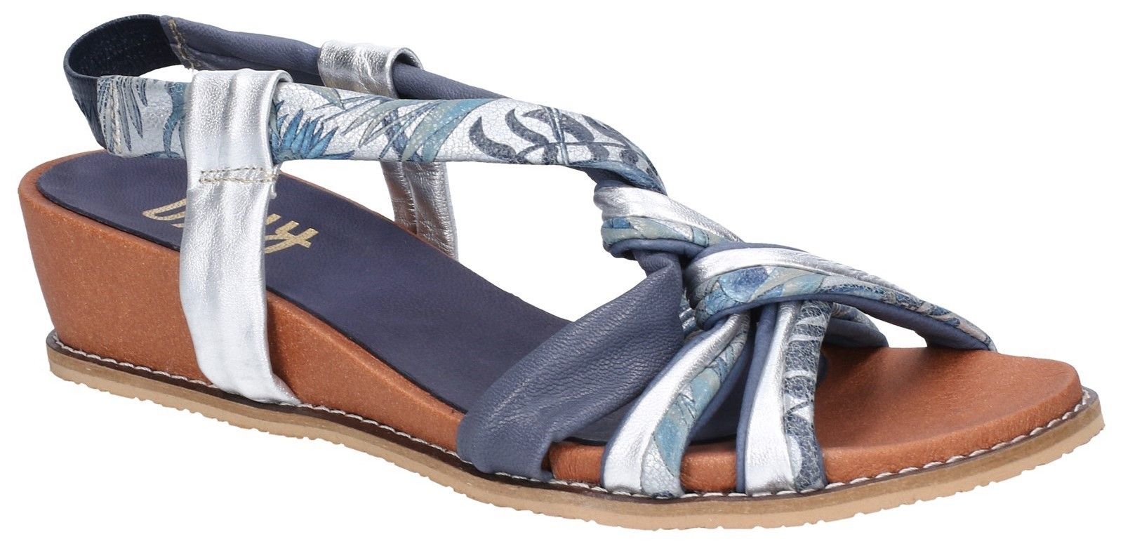 Women's low wedge caged strappy sandal crafted with luxuriously supple multi-leathers. A chic sling-back strap keeps this beach style secure and comfortable.Luxuriously supple multi-leather uppers. 
Strappy sandal with knotted caged open toe area. 
Comfortable sling-back strap. 
Stylish low wedge heel.