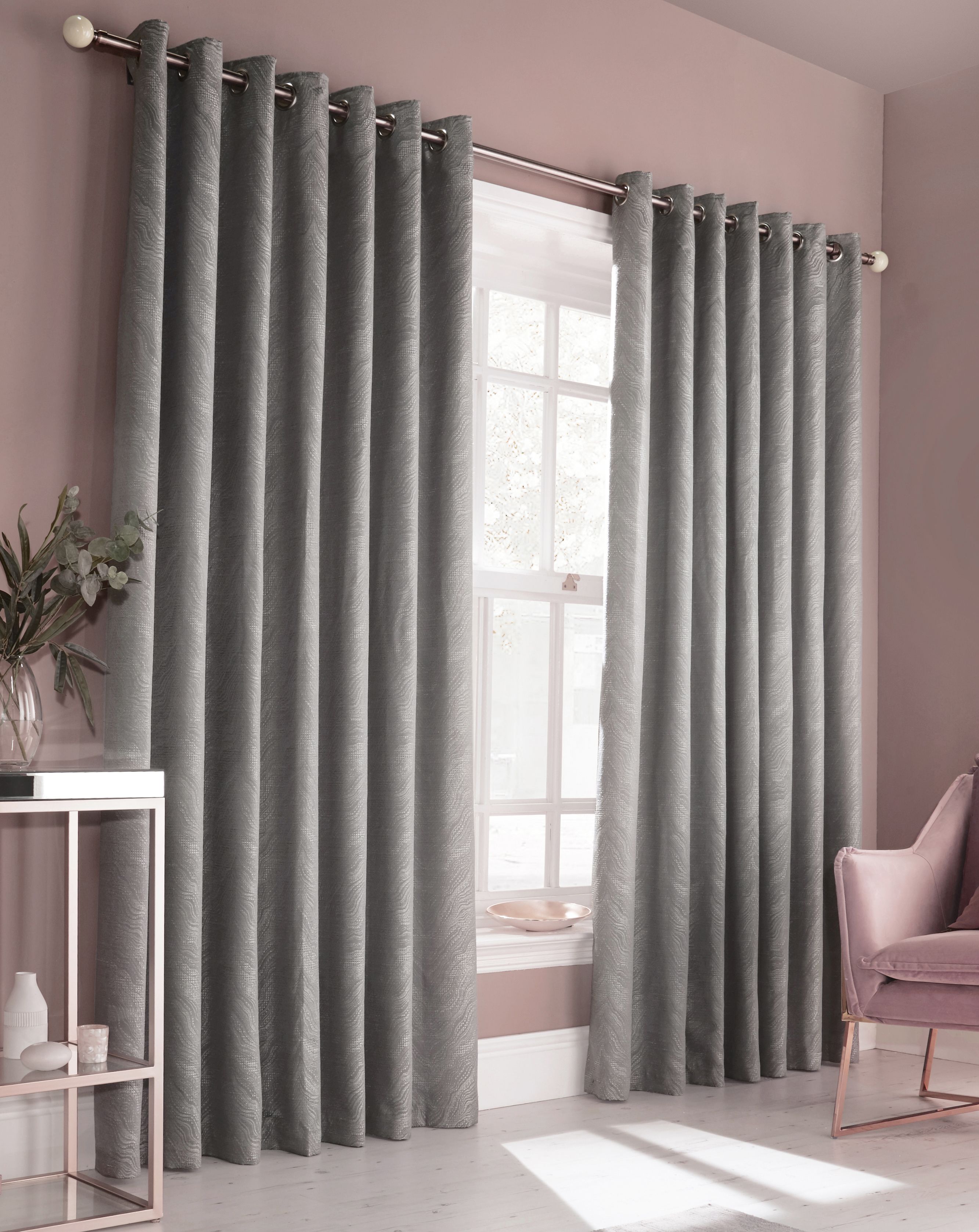 Add some glamour and style to your décor with this modern and chic curtain set. Featuring a luminescent jacquard pattern, inspired by natural marble and precious stones is accentuated when light catches. Perfect for a luxe styled bedroom or elegant living room, these curtains are bound to make a statement.