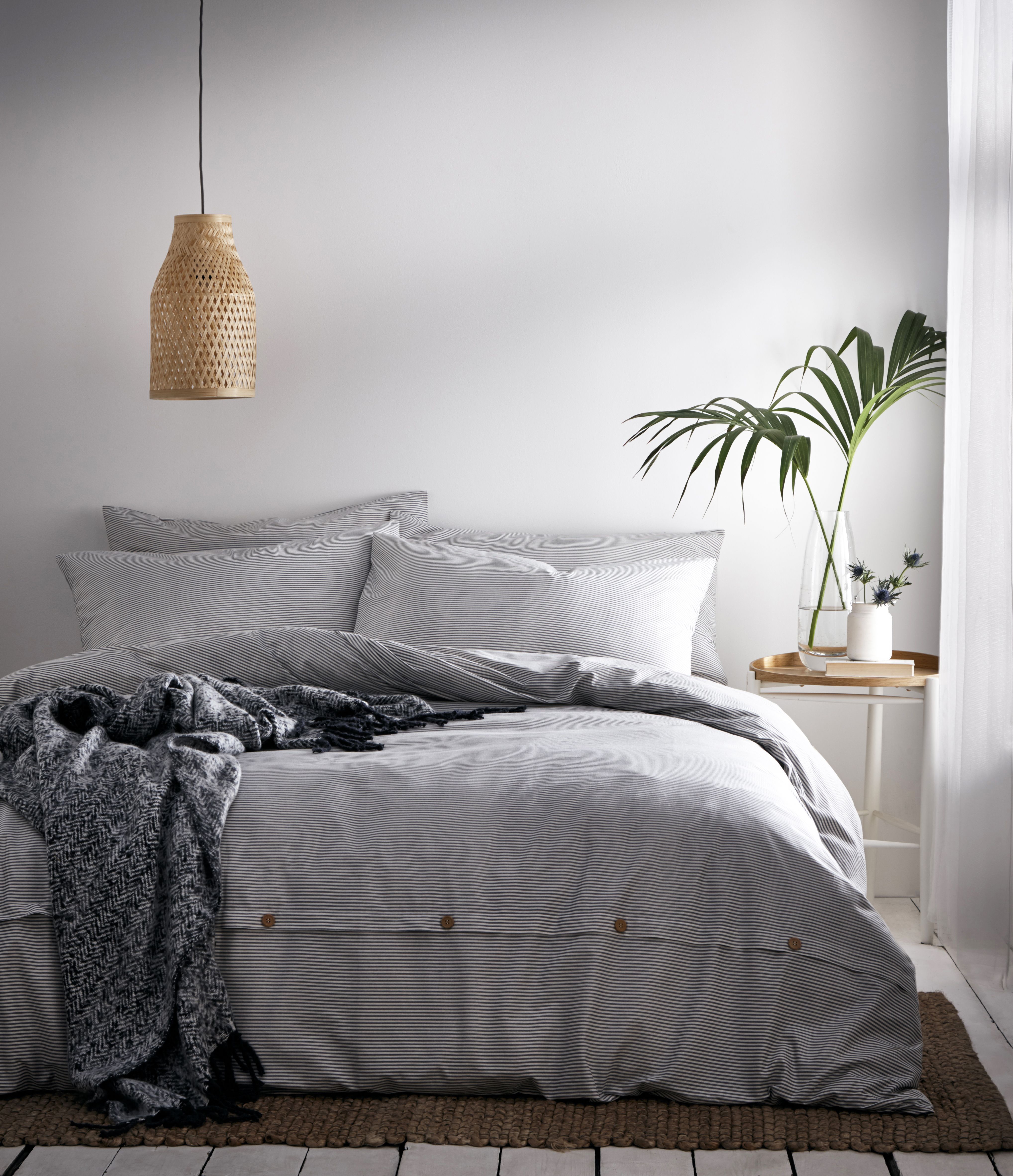 This duvet cover and pillow case set is both a classic but contemporary style, the subtle mélange print provides a luxurious woven striped appearance and the wooden button trim compliments the relaxed style. The Holbury duvet cover set has been garment washed and dried to give an ultra-soft, tumbled finish which gets softer with every wash at home.