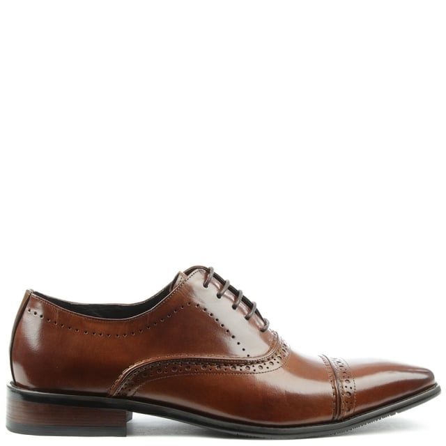 The Daniel Holnest Leather Square Toe Brogue is a staple for your wardrobe this Season. These classic smart shoes are crafted from a premium gloss leather upper with luxurious leather lining. Easy to wear lace up style provides the perfect fit. Raised seaming and top stitching add detail throughout as well as heritage brogue detailing.