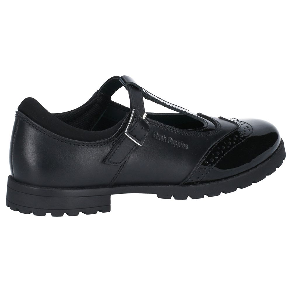 The girls Maisie Back to School shoe from Hush Puppies is a T-Bar strap style crafted with patent and smooth leather, featuring an embroidered Brogue detail. FIT LEFT FIT RIGHT removable insole feature creates a comfortable, customised fit