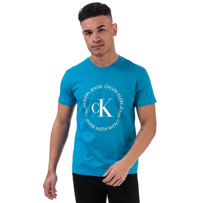 Mens Calvin Klein Round Logo T-Shirt in blue.<BR><BR>- Ribbed crew neck.<BR>- Short sleeves.<BR>- Calvin Klein Jeans logo print at centre chest.<BR>- Soft cotton jersey construction.<BR>- Regular fit.<BR>- 100% Cotton.  Machine wash at 30 degrees.<BR>- Ref: J30J314760C2O