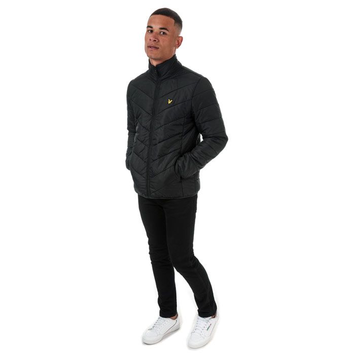Mens Lyle And Scott Puffer Jacket in true black.<BR><BR>- Funnel neck with ribbed inner collar.<BR>- Full zip fastening.<BR>- Long sleeves with stretch binding at cuffs.<BR>- Zipped side seam pockets.<BR>- Inner slip pockets.<BR>- Stretch binding at hem.<BR>- Embroidered eagle logo at left chest.<BR>- Durable ripstop nylon construction.<BR>- Fully lined.<BR>- Shell: 100% Nylon.  Body lining: 100% Nylon.  Sleeve lining: 100% Polyester.  Trim: 98% Polyester  2% Elastane.  Wadding: 100% Polyester.  Machine washable.<BR>- Ref: JK1202V572