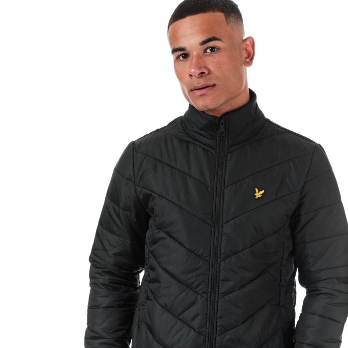 Mens Lyle And Scott Puffer Jacket in true black.<BR><BR>- Funnel neck with ribbed inner collar.<BR>- Full zip fastening.<BR>- Long sleeves with stretch binding at cuffs.<BR>- Zipped side seam pockets.<BR>- Inner slip pockets.<BR>- Stretch binding at hem.<BR>- Embroidered eagle logo at left chest.<BR>- Durable ripstop nylon construction.<BR>- Fully lined.<BR>- Shell: 100% Nylon.  Body lining: 100% Nylon.  Sleeve lining: 100% Polyester.  Trim: 98% Polyester  2% Elastane.  Wadding: 100% Polyester.  Machine washable.<BR>- Ref: JK1202V572