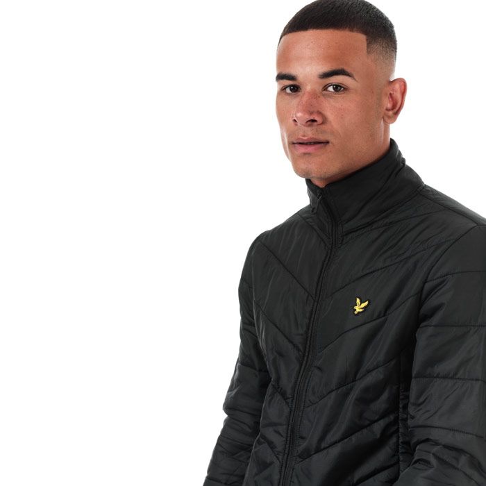 Mens Lyle And Scott Puffer Jacket in true black.<BR><BR>- Funnel neck with ribbed inner collar.<BR>- Full zip fastening.<BR>- Long sleeves with stretch binding at cuffs.<BR>- Zipped side seam pockets.<BR>- Inner slip pockets.<BR>- Stretch binding at hem.<BR>- Embroidered eagle logo at left chest.<BR>- Durable ripstop nylon construction.<BR>- Fully lined.<BR>- Shell: 100% Nylon.  Body lining: 100% Nylon.  Sleeve lining: 100% Polyester.  Trim: 98% Polyester  2% Elastane.  Wadding: 100% Polyester.  Machine washable.<BR>- Ref: JK1202V572