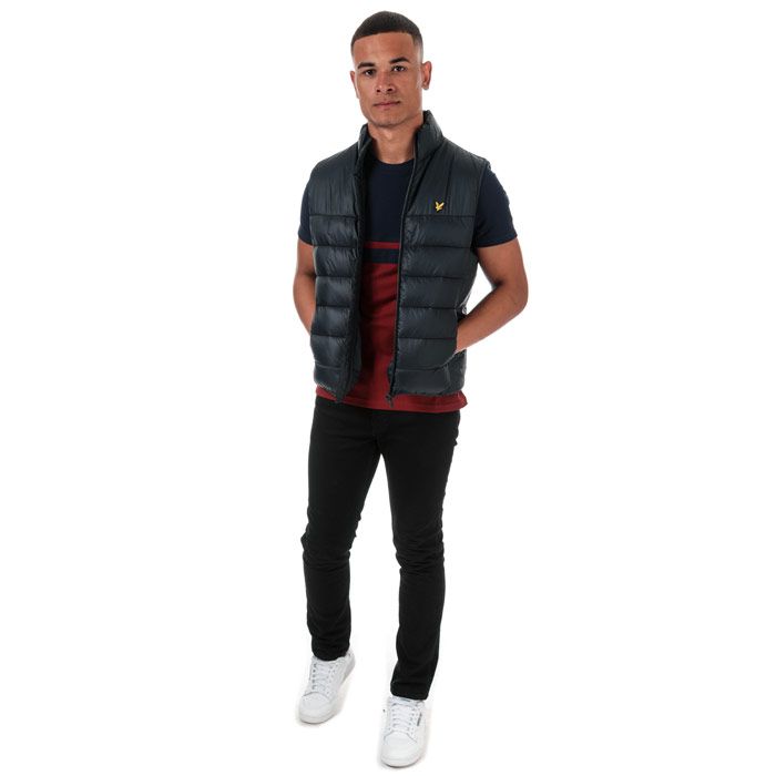 Mens Lyle And Scott Wadded Gilet in dark navy.<BR><BR>- Funnel neck.<BR>- Full zip fastening.<BR>- Sleeveless with stretch binding trim.<BR>- Side seam pockets.<BR>- Inner slip pockets.<BR>- Stretch binding at hem.<BR>- Embroidered eagle logo at left chest.<BR>- Fully lined.<BR>- Shell: 100% Nylon.  Lining: 100% Nylon.  Wadding: 100% Polyester.  Wipe clean only.<BR>- Ref: JK1231VZ271