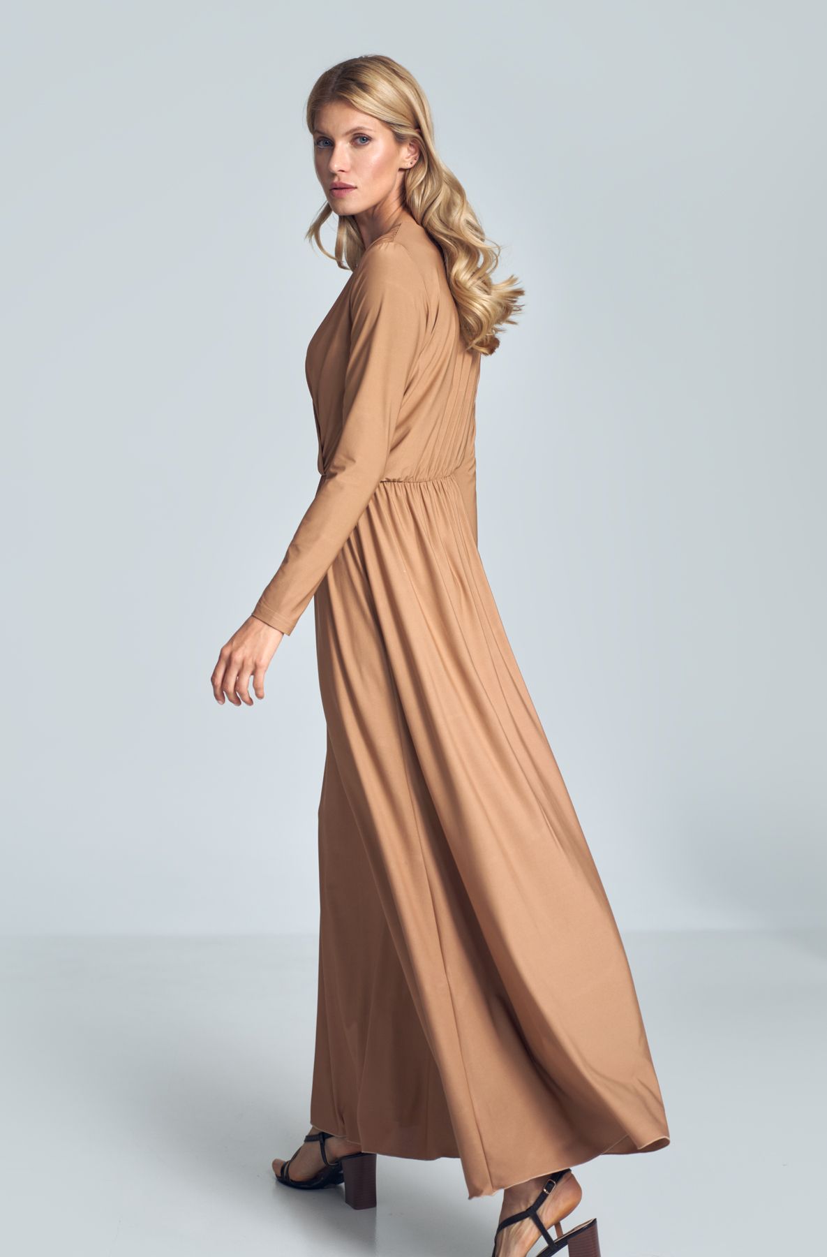 Beige maxi dress with long sleeves, wrap creased neckline, elasticated band sewn in the waist.