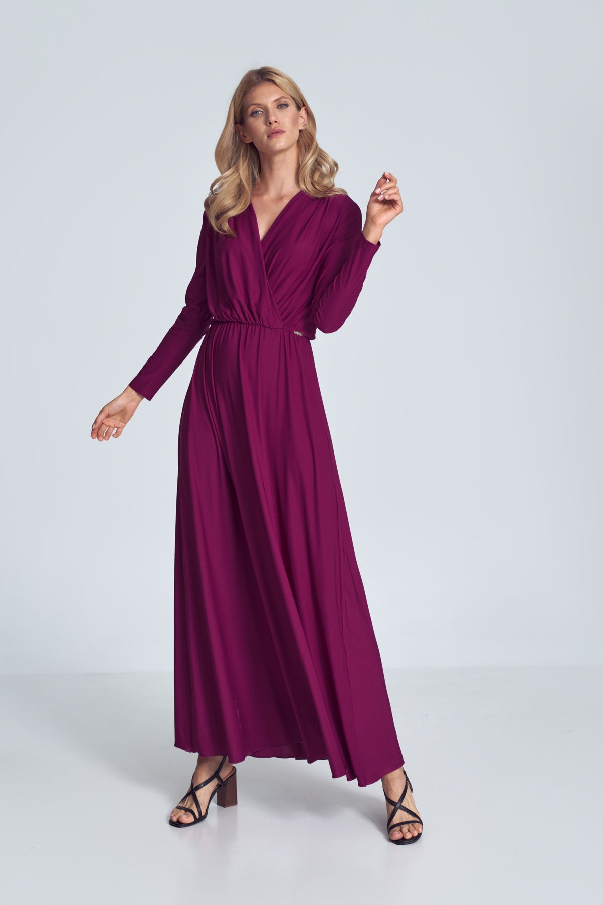 Fuchsia maxi dress with long sleeves, wrap creased neckline, elasticated band sewn in the waist.