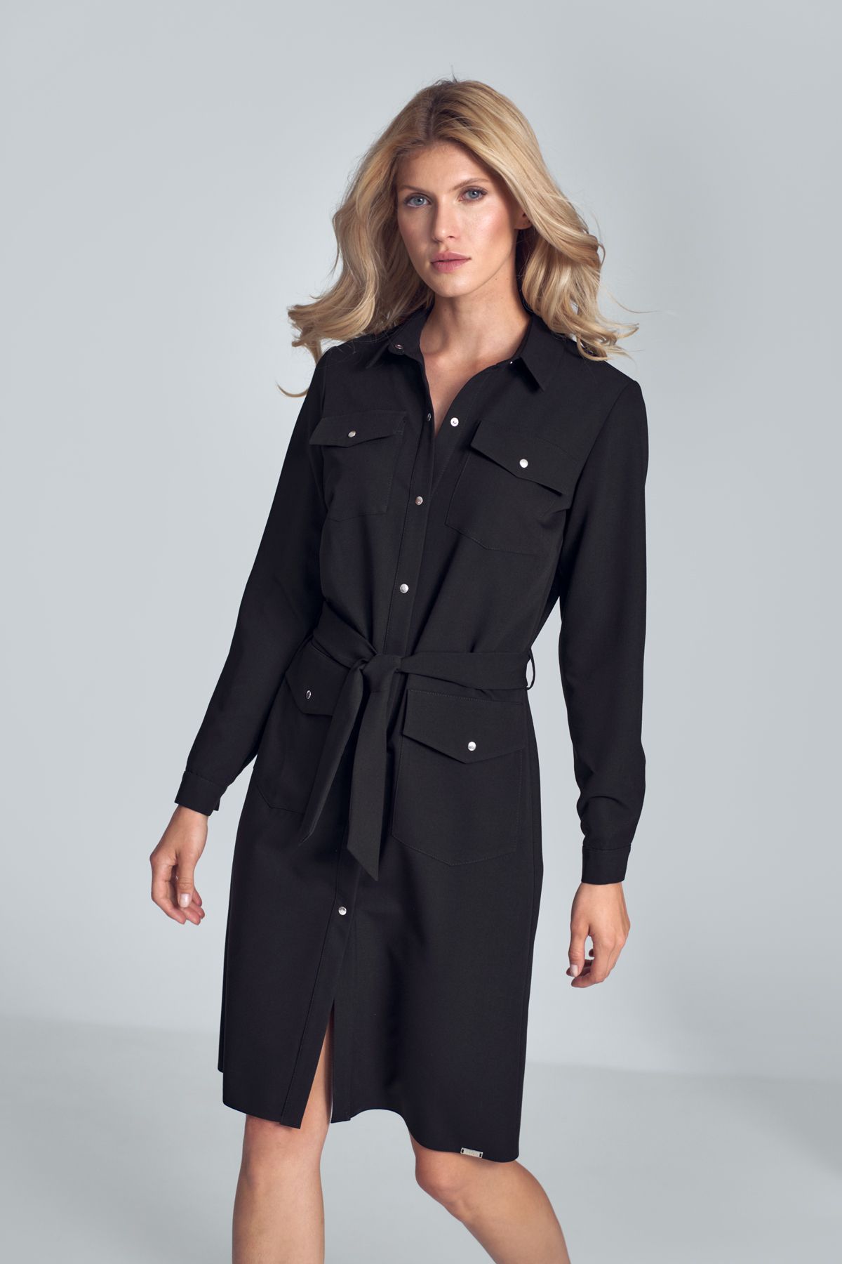 Black shirt midi dress with long sleeve, tied at the waist with a fabric belt, fastened with snaps, four  pockets on the front.