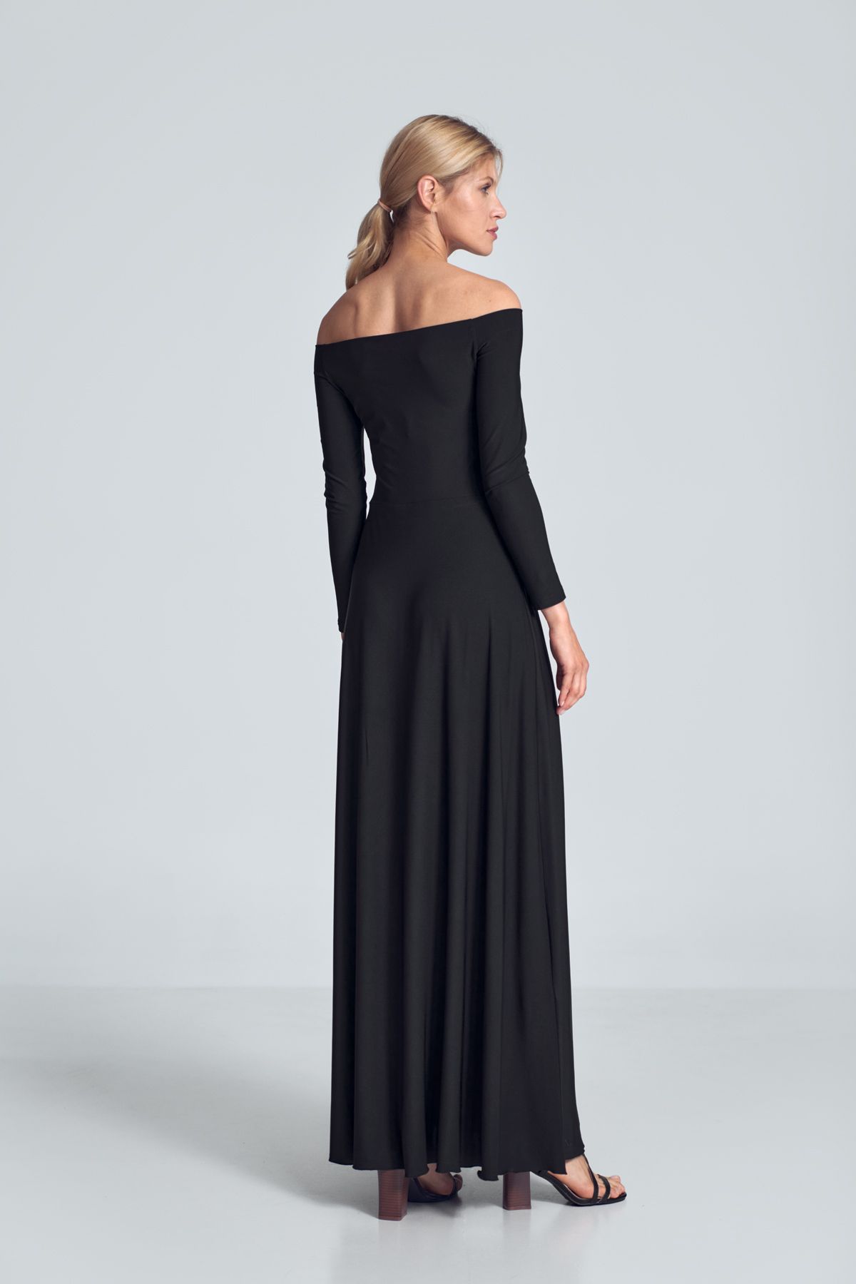 Black sensual maxi dress with long sleeves, large neckline - cold shoulders, pleats at the bust, sewn at the waist.