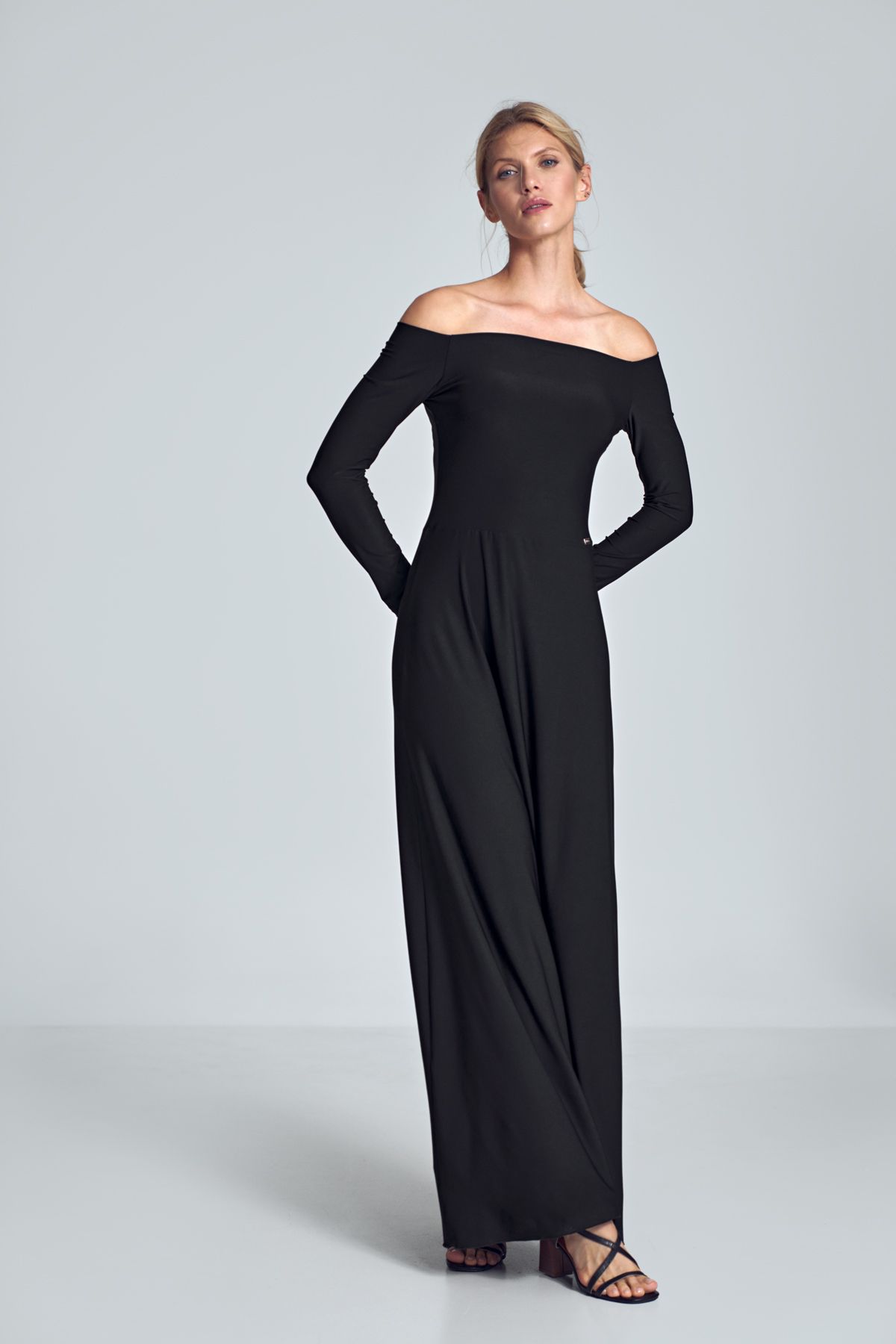 Black sensual maxi dress with long sleeves, large neckline - cold shoulders, pleats at the bust, sewn at the waist.