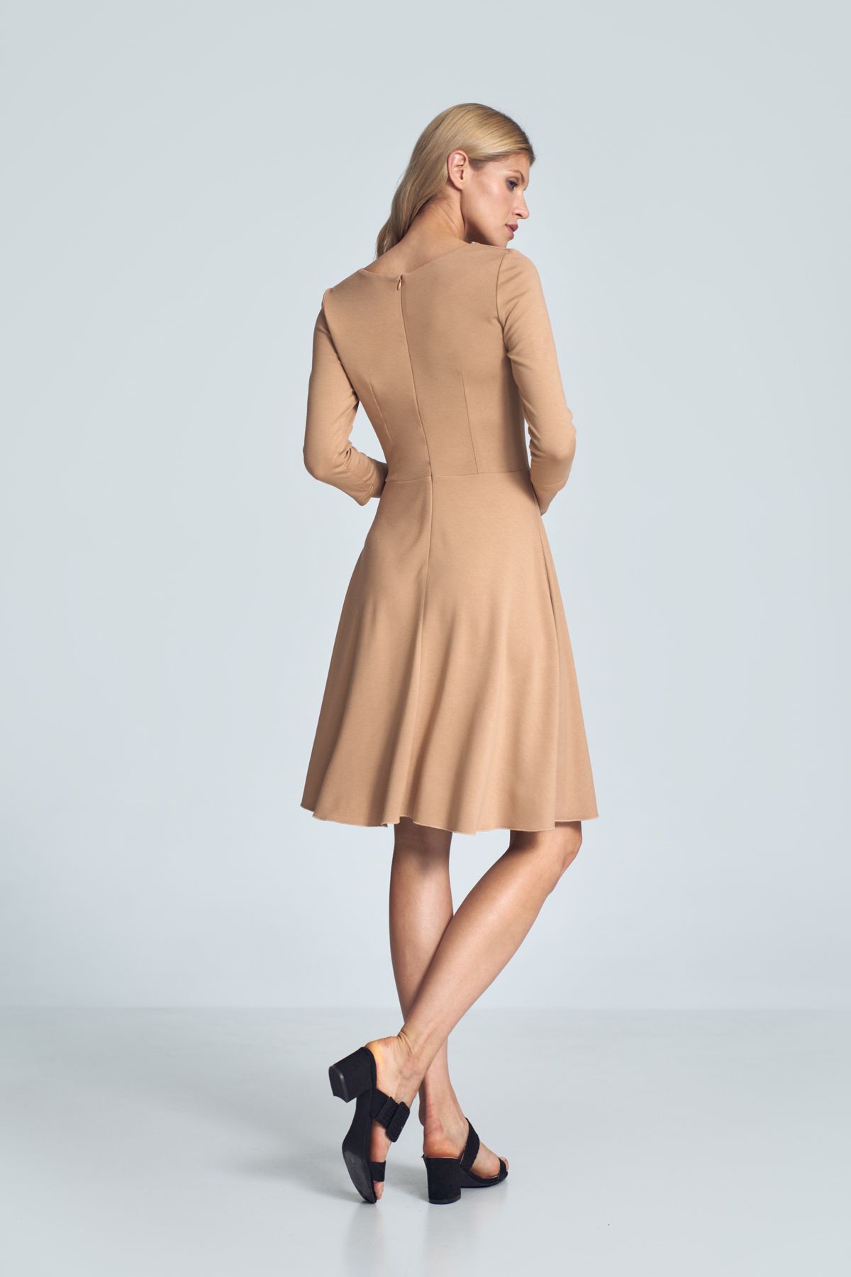 Beige cocktail midi dress with a V-neck, ¾ sleeve, pleats at the bust, sewn at the waist, flared hem. Fastened at the back with a covered zipp.