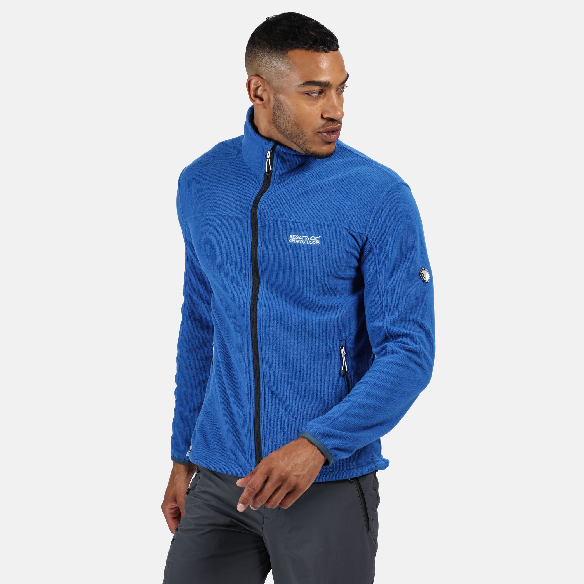 Material: 100% Polyester. Zip sweater with 180gsm mini-grid fleece fabric with one side brushed. Stand collar, adjustable shock-cord hem and stretch binding. 2 zipped lower pockets. Regatta outdoors logo embroidery on the chest.