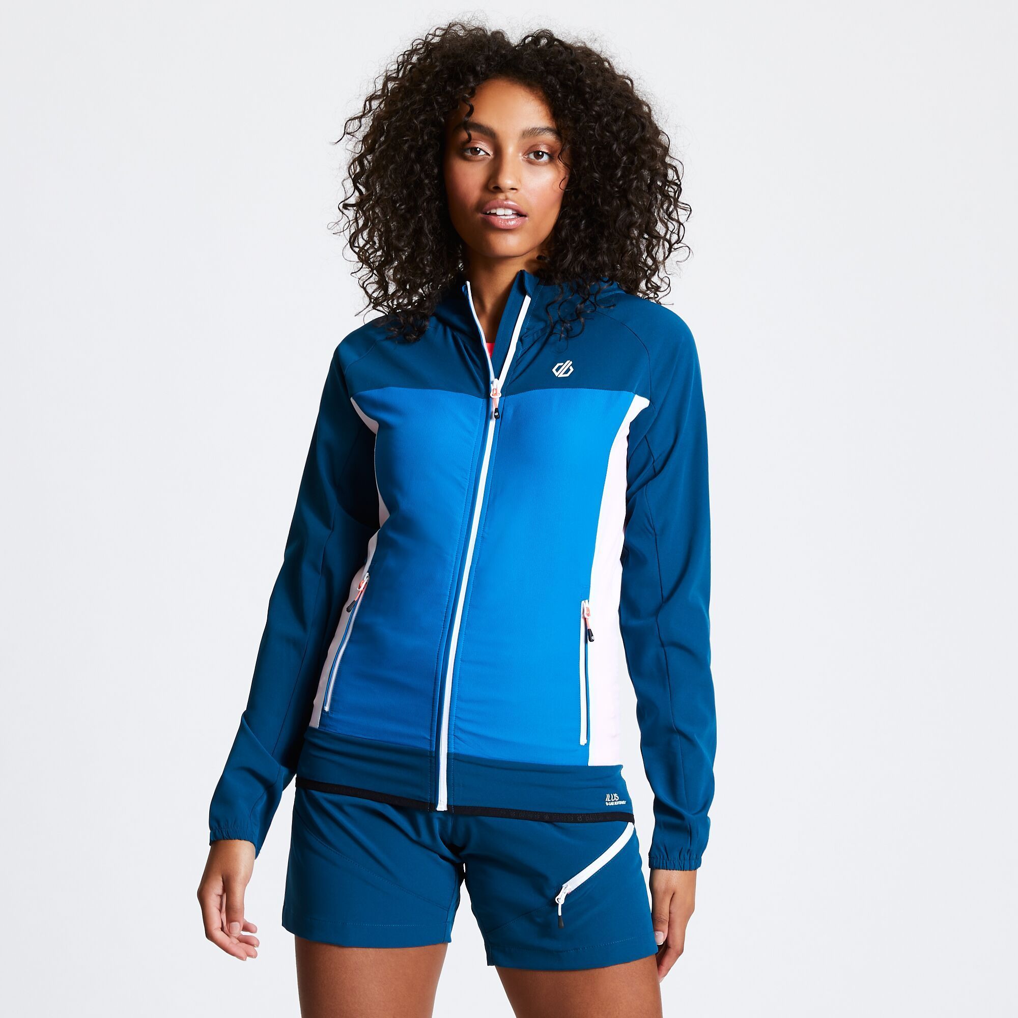 Material: 94% Polyester, 6% Elastane. Lightweight, water-resistant and highly breathable softshell jacket made from Ilus Softshell woven stretch polyester fabric. Streamlined design with a close-fitting, elasticated hood. Stretch binding to hood and hem. 2 zipped lower pockets.