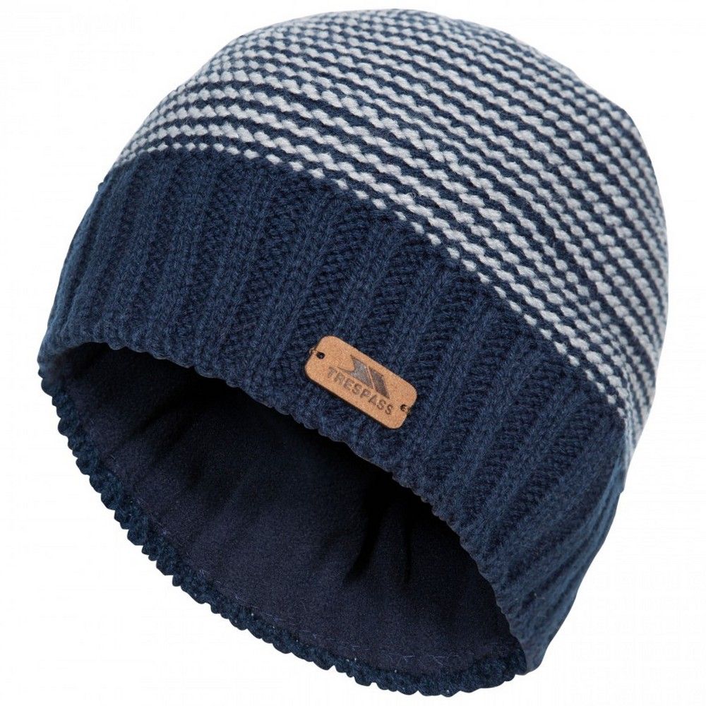 Material: polyester, acrylic. Patterned knit beanie. Half fleece lined. Leatherette badge.