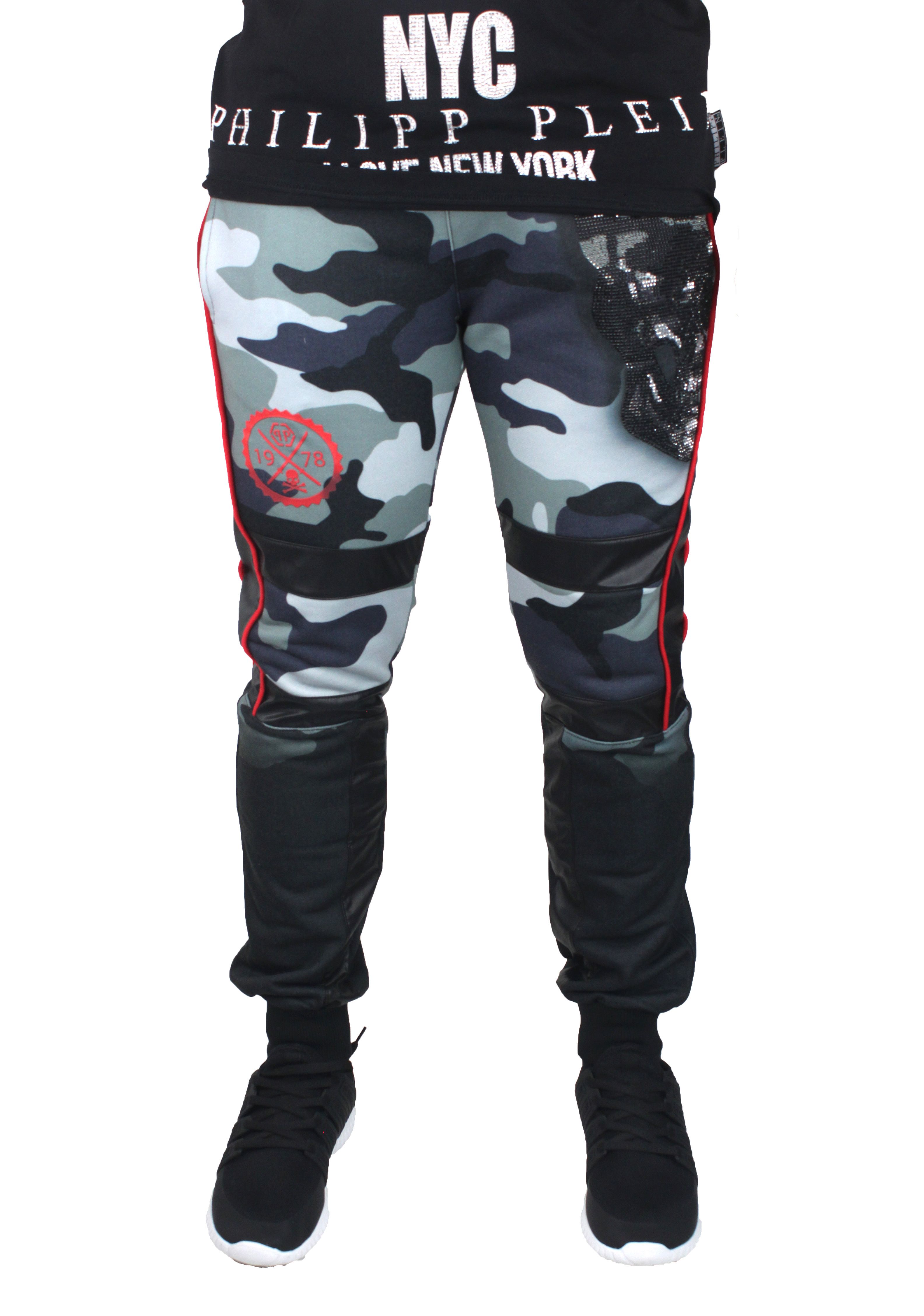 Philipp Plein MJT0171 Raitaro CM99 Sweat Pants. Philipp Plein Green Camo Sweat Pants. 100% Cotton. Iconic prints on the front and the back embellished in diamantes. Metal plated logo on the back pocket. Green Camo Pattern