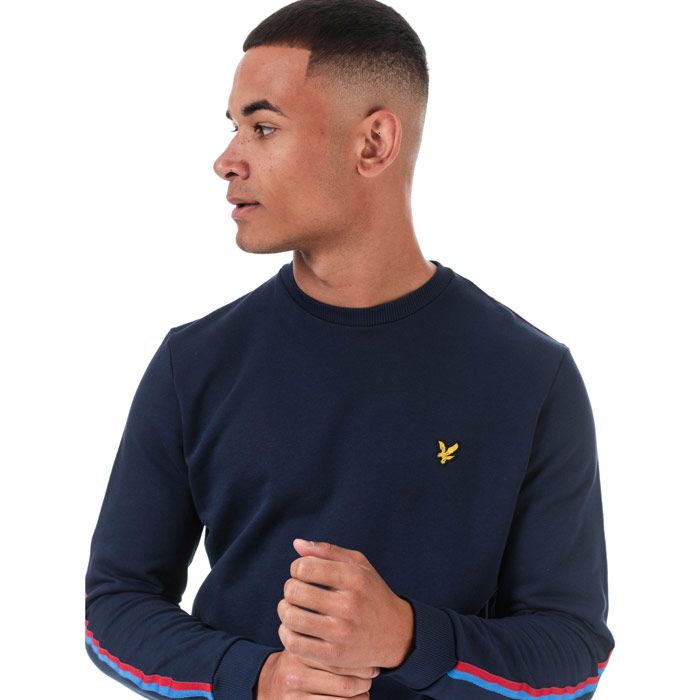 Mens Lyle And Scott Taped Crew Neck Sweatshirt in navy - gala red.<BR><BR>- Ribbed crew neck.<BR>- Long sleeves.<BR>- Retro-inspired two-tone tape at shoulders and sleeves.<BR>- Embroidered eagle logo at left chest.<BR>- Ribbed cuffs and hem.<BR>- Woven herringbone back neck tape.<BR>- Soft loopback cotton fleece construction.<BR>- Regular fit.<BR>- 100% Cotton. Machine washable.<BR>- Ref: ML1292VZ857