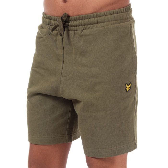 Mens Lyle And Scott Sweat Shorts in lichen green.<BR><BR>- Elasticated waist with drawcord. <BR>- Side welt pockets. <BR>- Rear patch pocket.<BR>- Embroidered eagle logo at left thigh.<BR>- Soft loopback cotton fleece construction.<BR>- Regular fit.<BR>- Inside leg length measures 8“ approximately.<BR>- 100% Cotton.  Machine washable.<BR>- Ref: ML414VTRZ801<BR><BR>Measurements are intended for guidance only.