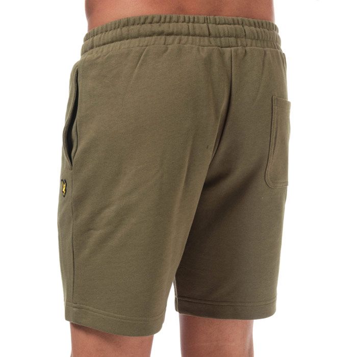 Mens Lyle And Scott Sweat Shorts in lichen green.<BR><BR>- Elasticated waist with drawcord. <BR>- Side welt pockets. <BR>- Rear patch pocket.<BR>- Embroidered eagle logo at left thigh.<BR>- Soft loopback cotton fleece construction.<BR>- Regular fit.<BR>- Inside leg length measures 8“ approximately.<BR>- 100% Cotton.  Machine washable.<BR>- Ref: ML414VTRZ801<BR><BR>Measurements are intended for guidance only.