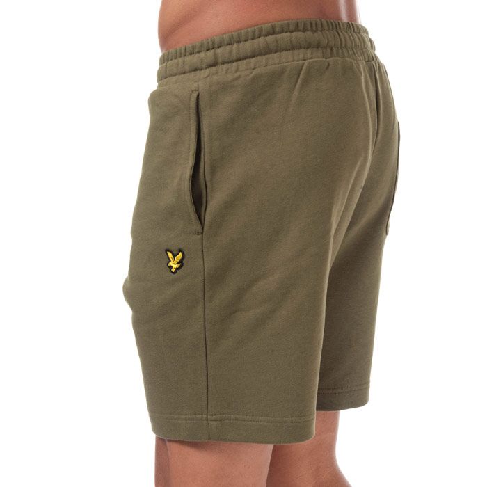 Mens Lyle And Scott Sweat Shorts in lichen green.<BR><BR>- Elasticated waist with drawcord. <BR>- Side welt pockets. <BR>- Rear patch pocket.<BR>- Embroidered eagle logo at left thigh.<BR>- Soft loopback cotton fleece construction.<BR>- Regular fit.<BR>- Inside leg length measures 8“ approximately.<BR>- 100% Cotton.  Machine washable.<BR>- Ref: ML414VTRZ801<BR><BR>Measurements are intended for guidance only.
