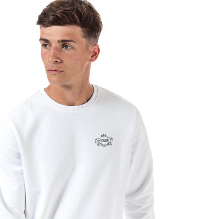 Mens Guess Breana Crew Sweatshirt in white.<BR><BR>- Ribbed crew neck.<BR>- Long sleeves.  <BR>- Guess branding printed at left chest.<BR>- Rubberised Guess brand tab above left cuff.<BR>- Ribbed cuffs and hem.  <BR>- Tonal back neck tape.<BR>- Comfortable cotton loop back jersey construction.<BR>- Regular fit.<BR>- 100% Cotton.  Machine washable.  <BR>- Ref: MOGQ64
