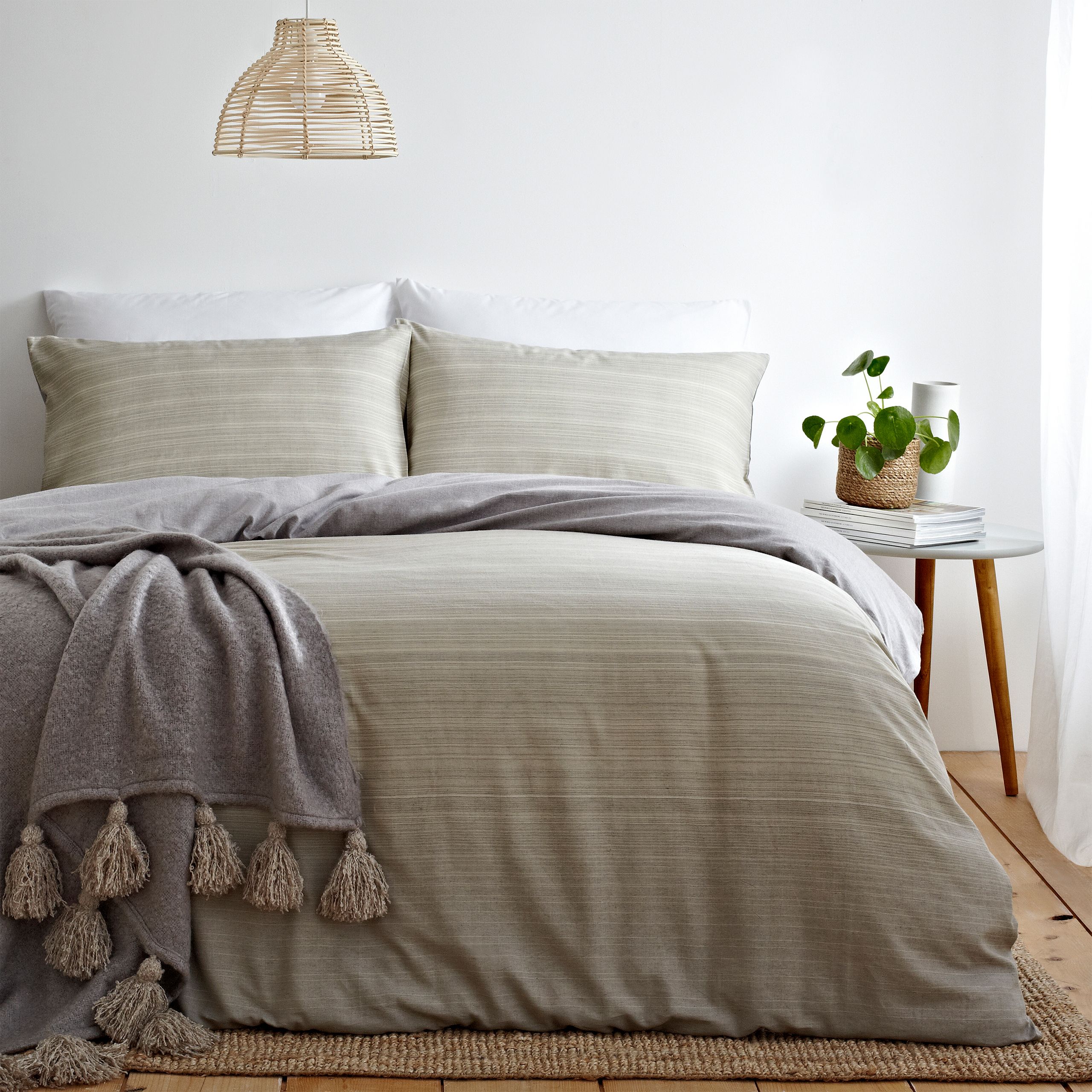 Create a signature look with this perfectly relaxed duvet cover and pillow case set. With soft earthy tones, this design creates a warm and restful mood. The reversible design allows the subtle ombre effect to give a natural textured apperance whilst the chambray grey reverse is ultra versitable for any bedroom.