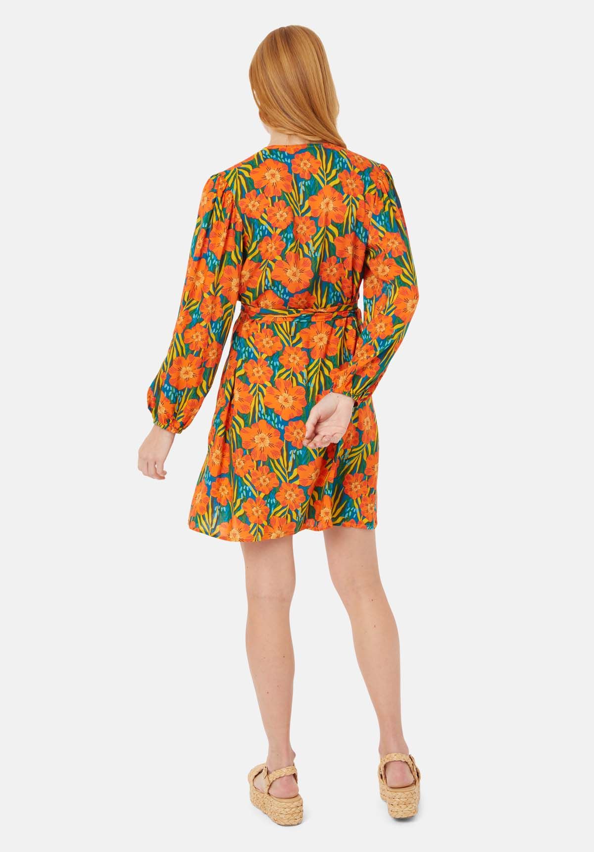 Scattered in a bold tropical floral print, the Mutiny Mini Wrap Dress is perfect for your summer wardrobe. This elegant and dreamy design is crafted to a signature wrap silhouette and complete with a v-neckline and long sleeves. 100% Viscose. Machine Wash at 30c.