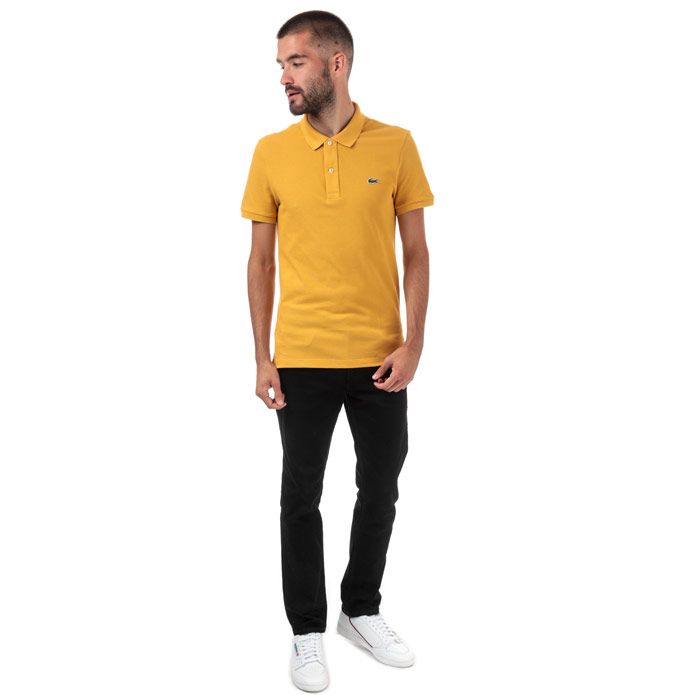 Mens Lacoste Slim Fit Petit Polo Shirt  Yellow. <BR><BR>- Signature design. <BR>- Cotton pique combines comfort and elegance.<BR>- Slim fit.<BR>- Ribbed collar and armbands.<BR>- 2-button placket.<BR>- Green crocodile embroidered on chest. <BR>- Cotton 100%. Machine washable.<BR>- Ref: PH4012004BW.