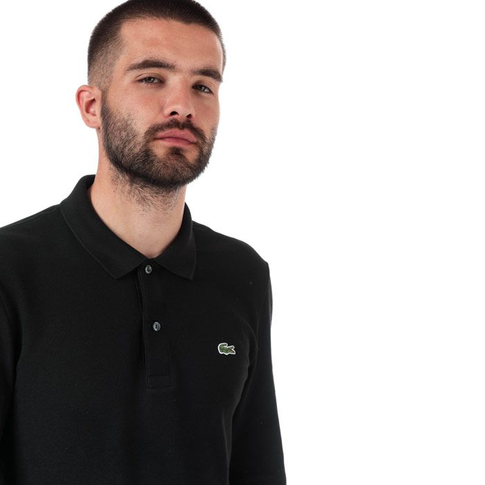15 Mens Lacoste Slim Fit Long Sleeve Polo  Black. <BR><BR>- Two-ply cotton petit pique.<BR>- Two-button collar.<BR>- Slim fit.<BR>- Ribbed finishes at neckline and wristbands.<BR>- Embroidered green crocodile applique on chest.<BR>- Cuff rib; Cotton 95%  Elastane 5%. Main fabric; Cotton 100%. Machine washable.<BR>- Ref: PH401300031.