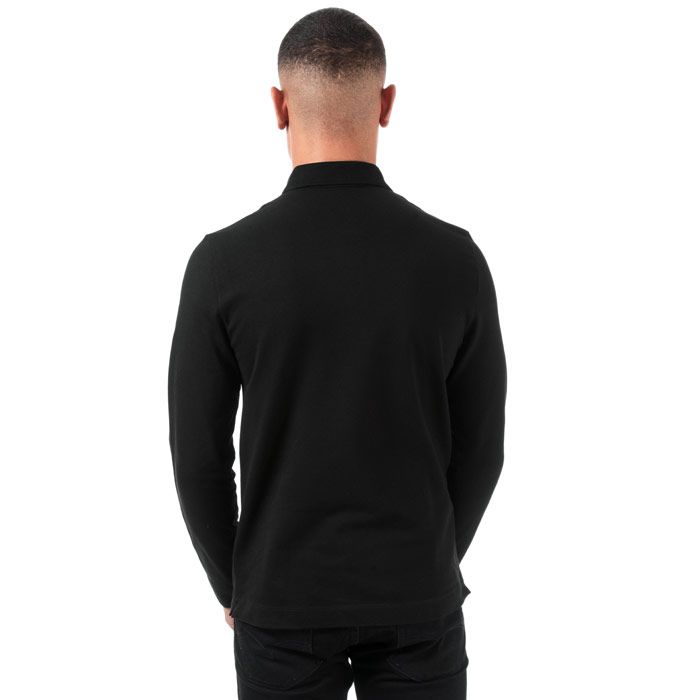 Mens Lacoste Regular Fit Paris Long Sleeve Stretch Cotton Pique Polo Shirt  Black. <BR><BR>- Signature design. <BR>- Unicolour stretch cotton piqué.<BR>- Regular Fit.<BR>- Ribbed collar and armbands.<BR>- Shirt collar with concealed button placket.<BR>- Embroidered tone-on-tone crocodile on chest.<BR>- Cotton 94%  Elastane 6%  Machine washable.<BR>- Ref: PH943500031.