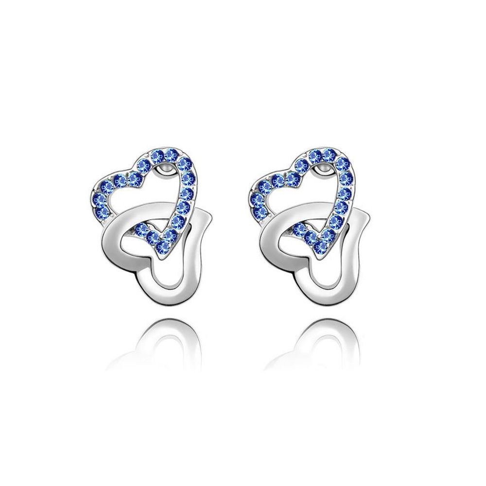 Double Hearts Earrings made with a Blue Crystal from Swarovski This pair of earrings in 18K white gold plated (3 layers) is composed of two intertwined hearts, one of which is made with blue crystals from Swarovski. Size: 17 x 13 mm Suitable for pierced ears