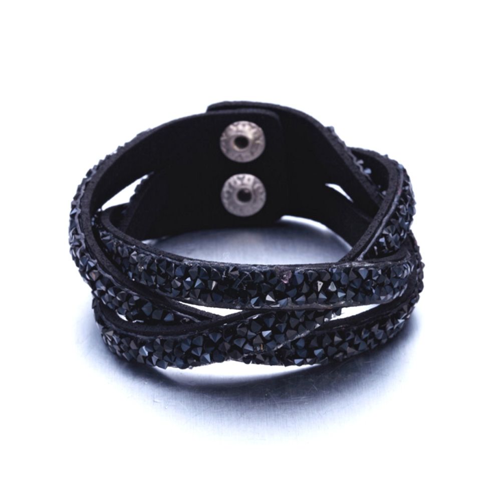 Black Swarovski Crystal Elements and Leather Interlaced Bracelet This beautiful bracelet leather black color is composed of 3 interlaced rows. These rows are set with a multitude of black Swarovski Elements crystals with intense reflections. The clasp, stainless steel is double pressure for easy and quick handling. This bracelet sparkles and you sublimate at your parties! Dimensions: 20 cm x 2.3 cm Succumb to the beauty of this bracelet that will not disappoint.