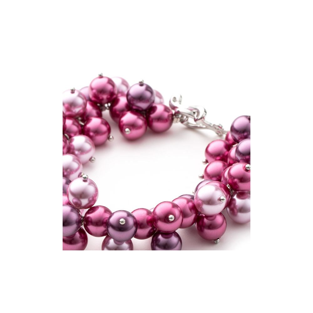 Pink and Fuchsia Multi Pearls Bracelet This charming bracelet is made of pink and fushia synthetic beads. The toggle clasp is worked as S. Frame high quality alloy Rhodium plated for a perfect finish and extreme shine. Elegant and original, this is the perfect accessory for a night or to illuminate a simple outfit. Description: Type of Clasp: Toggle Strap Length: 22 cm Bead diameter: 5 to 7 mm Color: Pink and Fuchsia